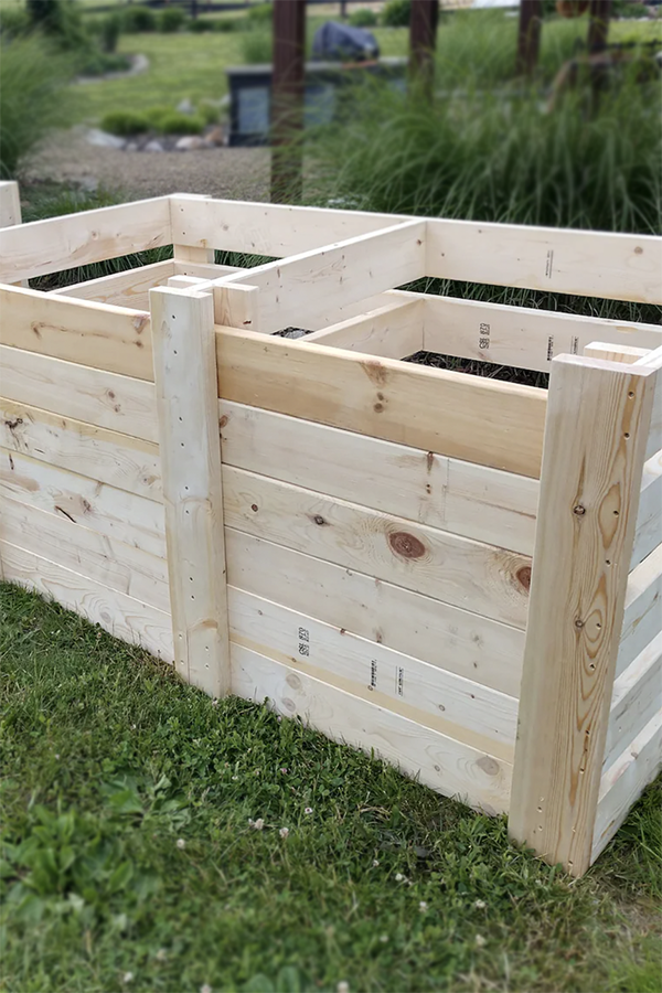 A one and a two-bin compost system built out of new lumber. 