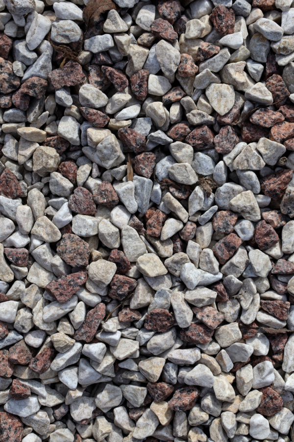 A pile of rough gravel in different shades of gray and browns.
